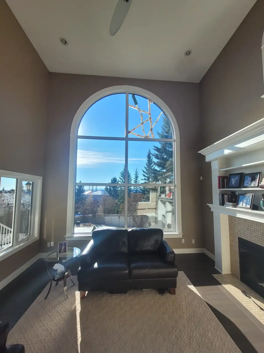 Tall arched living room window in a Calgary home